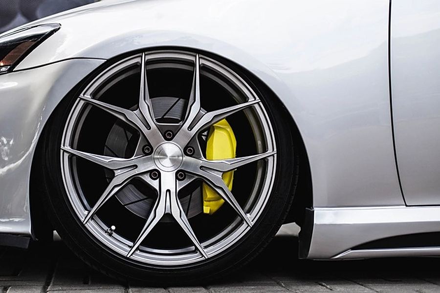 Alloy wheel with the brake caliper showing through the spokes